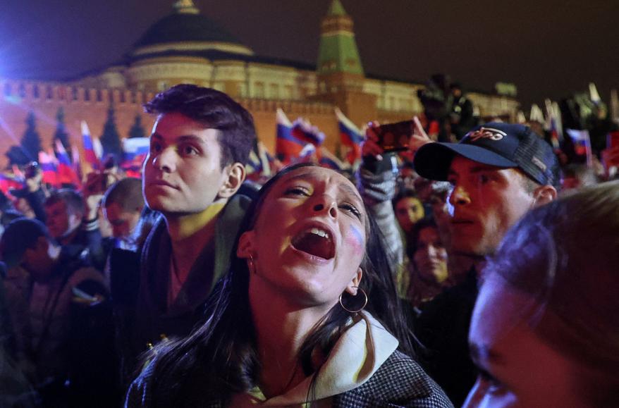 A spectator reacts during a concert outside the Kremlin.