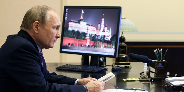 Russian President Vladimir Putin attends a meeting on economic issues via videoconference at the Novo-Ogaryovo residence outside Moscow, Russia, Thursday, Oct. 6, 2022. 