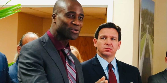 Florida Surgeon General Joseph Ladapo and Gov. Ron DeSantis at a news conference in West Palm Beach, Florida on Thursday, Jan. 6, 2022. (Joe Cavaretta/Sun Sentinel/Tribune News Service via Getty Images)