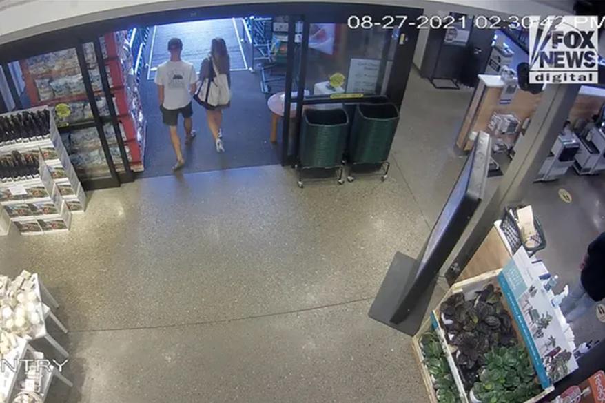 Gabby Petito and Brian Laundrie are spotted on a surveillance camera leaving the Jackson, Wyo., Whole Foods on Aug. 27, 2021.