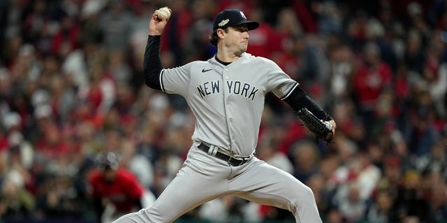 Gerrit Cole #45 of the New York Yankees delivers a pitch against the Cleveland Guardians during the first inning in game four of the American League Division Series at Progressive Field on October 16, 2022 in Cleveland, Ohio.