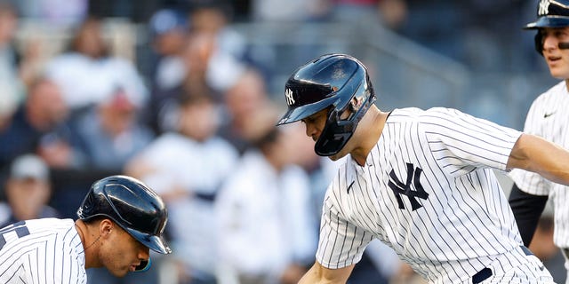 Giancarlo Stanton, right, of the New York Yankees celebrates his three-run home run with Gleyber Torres and Anthony Rizzo during the first inning against the Cleveland Guardians in Game 5 of an American League Division Series at Yankee Stadium Oct. 18, 2022, in New York.