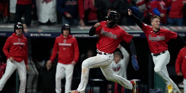 Amed Rosario #1 of the Cleveland Guardians scores the game winning run during the ninth inning against the New York Yankees in game three of the American League Division Series at Progressive Field on October 15, 2022 in Cleveland, Ohio.