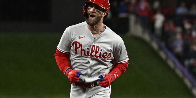 Bryce Harper #3 of the Philadelphia Phillies celebrates after hitting a solo home run against the St. Louis Cardinals during the second inning in game two of the National League Wild Card Series at Busch Stadium on October 08, 2022 in St Louis, Missouri.