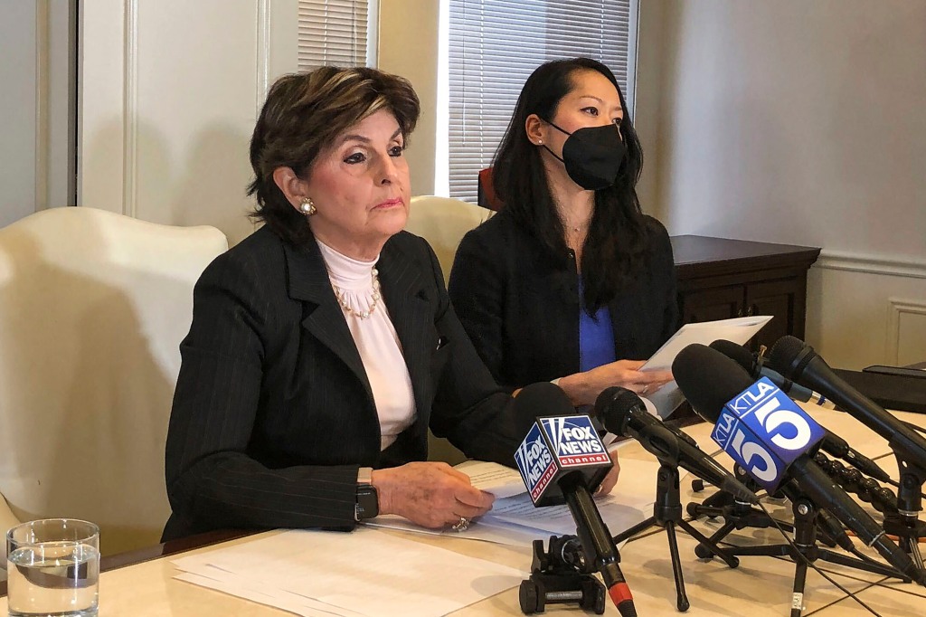 The woman's attorney Gloria Allred speaks to reporters