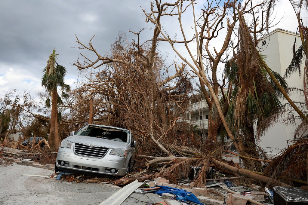 A destroyed vehicle lays among debris after Hurricane Ian passed through the area on October 08, 2022 in Sanibel, Florida