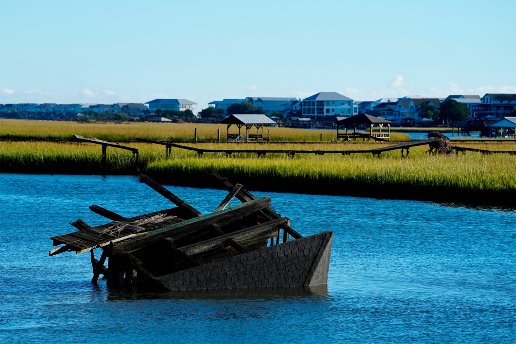 An overturned house boat on Pawleys Island, South Carolina on October 1, 2022.