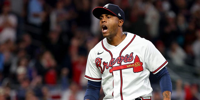 Raisel Iglesias #26 of the Atlanta Braves reacts after striking out Kyle Schwarber #12 of the Philadelphia Phillies to end the eighth inning in game two of the National League Division Series at Truist Park on October 12, 2022, in Atlanta, Georgia.