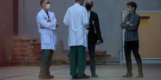 A group of doctors awaiting the arrival of Speaker Pelosi at Zuckerberg San Francisco General Hospital. 