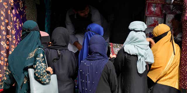 A group of Muslim women shop for clothes in Bengaluru, India, on Oct. 13, 2022, as Indian officials contemplate banning hijabs in the nation. 