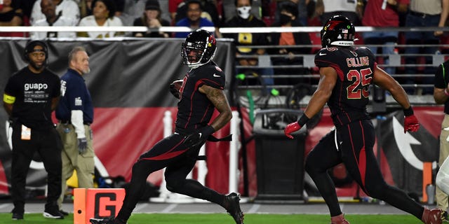 Isaiah Simmons #9 of the Arizona Cardinals scores a touchdown on a pass interception during the 2nd quarter of the game against the New Orleans Saints at State Farm Stadium on October 20, 2022, in Glendale, Arizona.