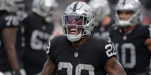 Josh Jacobs #28 of the Las Vegas Raiders celebrates a touchdown in the fourth quarter against the Houston Texans at Allegiant Stadium on October 23, 2022, in Las Vegas, Nevada.