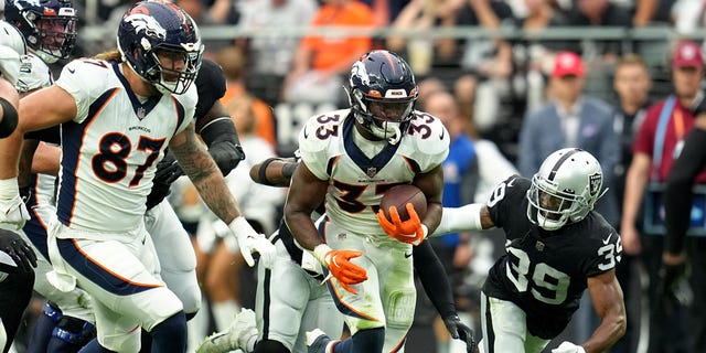 Javonte Williams #33 of the Denver Broncos runs with the ball in the second quarter against the Las Vegas Raiders at Allegiant Stadium on Oct. 2, 2022 in Las Vegas, Nevada. 