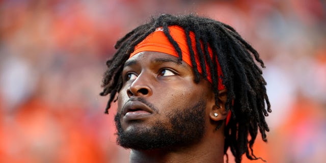 Javonte Williams #33 of the Denver Broncos listens to the national anthem against the San Francisco 49ers at Empower Field At Mile High on Sept. 25, 2022 in Denver, Colorado.