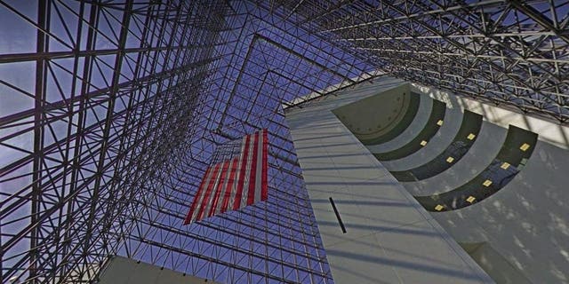 A photo of the inside of the John F. Kennedy Library and Museum shows the 115-foot-high glass pavilion overlooking Dorchester Bay.