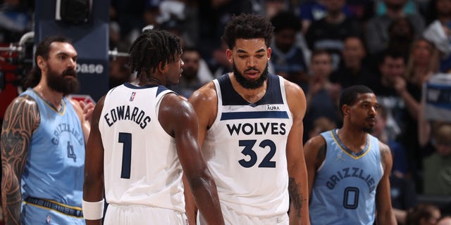 Anthony Edwards and Karl-Anthony Towns (32) of the Minnesota Timberwolves are shown on April 23, 2022, at Target Center in Minneapolis.