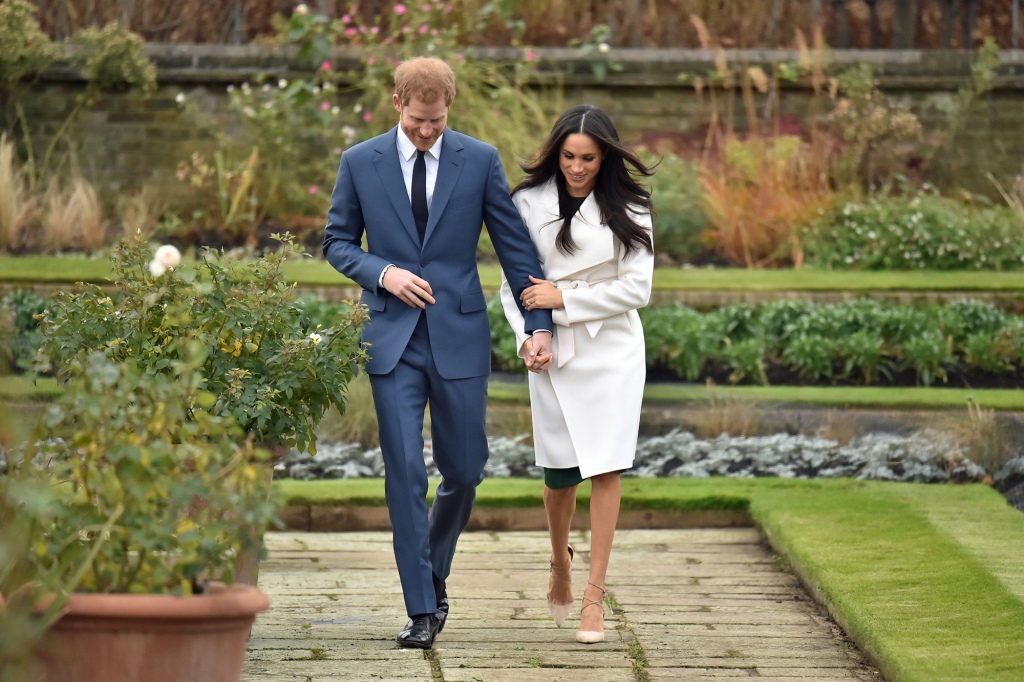 Prince Harry and Meghan Markle in the Sunken Garden at Kensington Palace, London, after the announcement of their engagement. (Photo by Dominic Lipinski/PA Images via Getty Images)