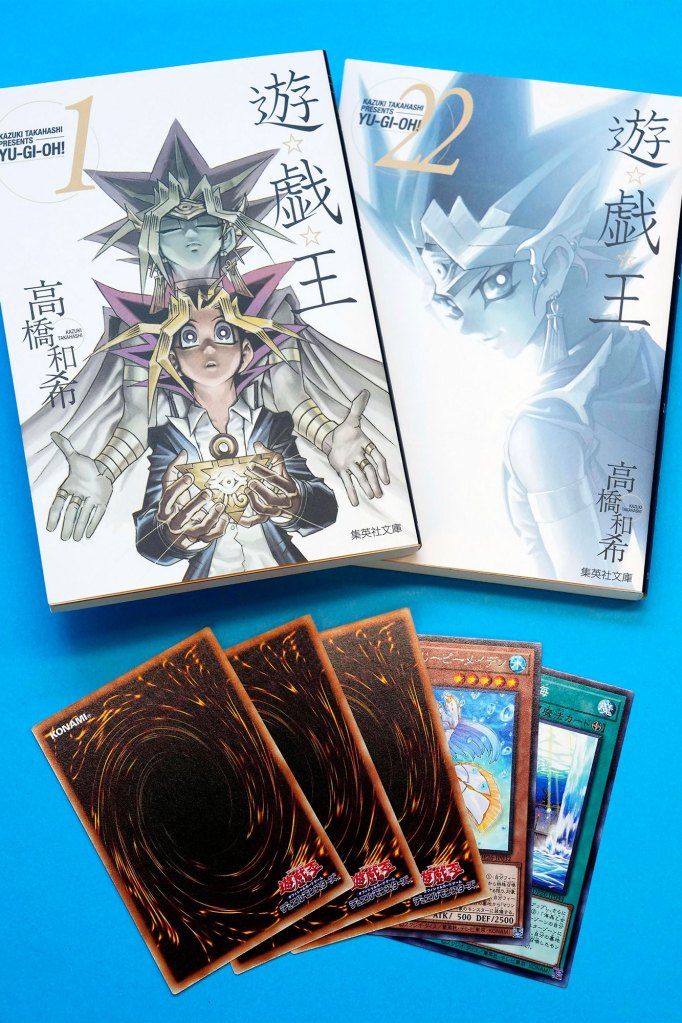 This photo shows “Yu-Gi-Oh!” manga comic and trading cards