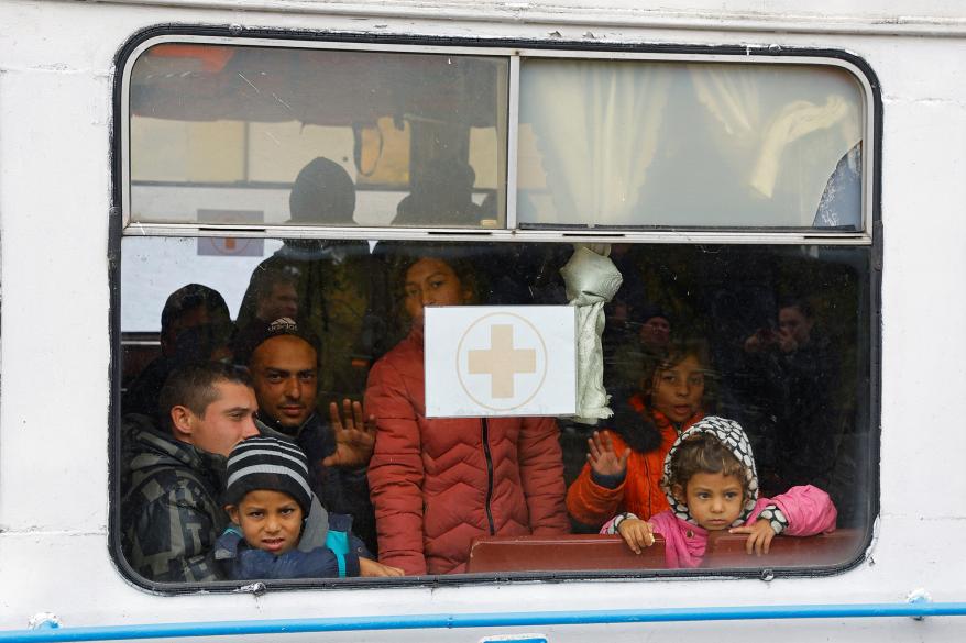 A picture of Civilians evacuating from the Russian-controlled city of Kherson.