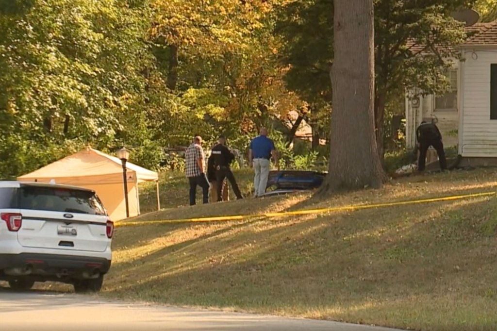 Police investigate the home of Timothy Haslett where he allegedly held a woman captive for weeks.