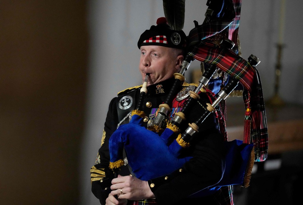 Burns is pictured playing at Queen Elizabeth's funeral last month.