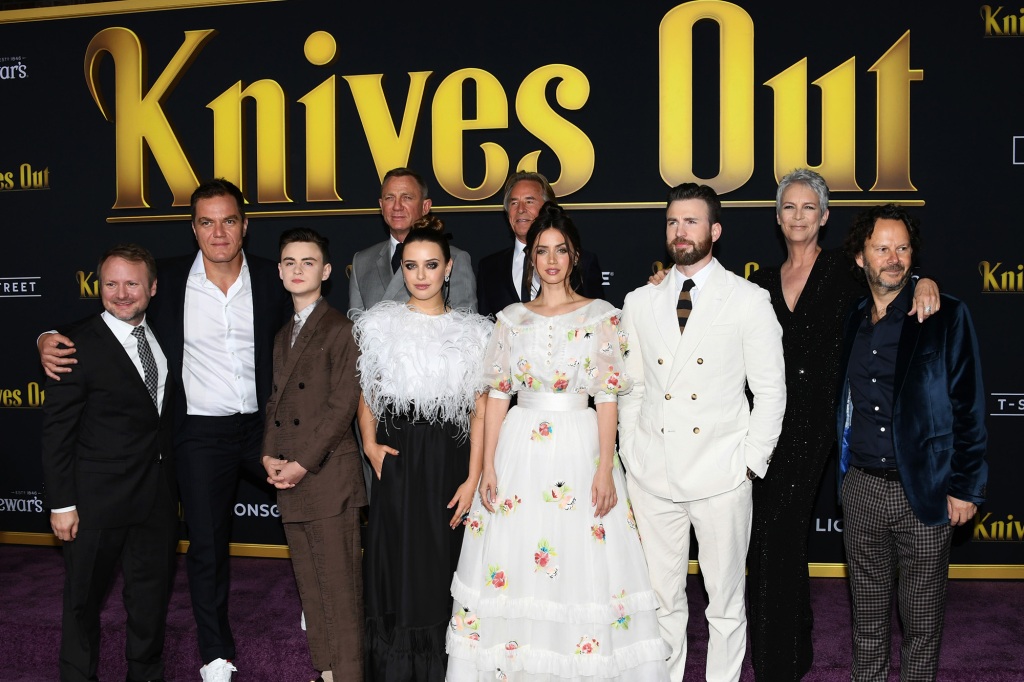 WESTWOOD, CALIFORNIA - NOVEMBER 14:  (L-R) Writer and director Rian Johnson, Michael Shannon, Jaeden Martell, Daniel Craig, Katherine Langford, Don Johnson, Ana de Armas, Chris Evans, Jamie Lee Curtis and Ram Bergman attend the premiere of Lionsgate's "Knives Out" at Regency Village Theatre on November 14, 2019 in Westwood, California. (Photo by Jon Kopaloff/Getty Images,)