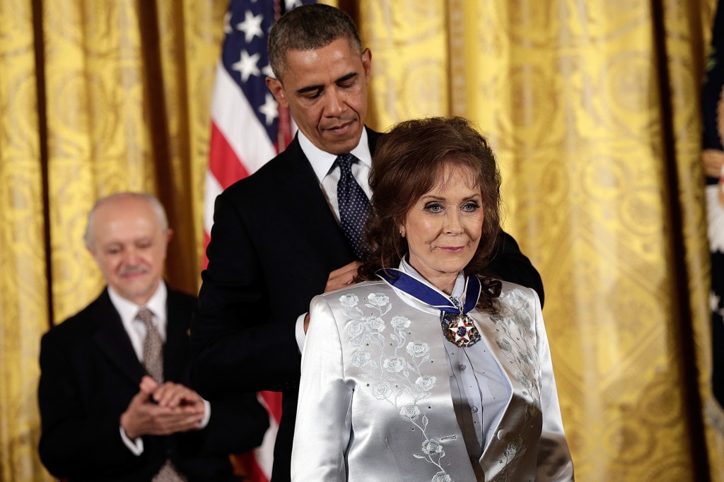 Lynn is seen receiving the Presidential Medal of Freedom from Barack Obama in 2013.