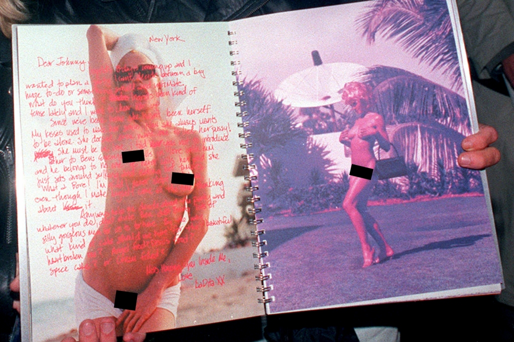 A couple shows racy pages from Madonna's "Sex" book in this 1992 photo.