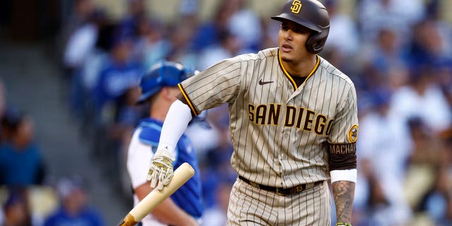 Manny Machado #13 of the San Diego Padres tosses his bat after a solo home run in the first inning in game two of the National League Division Series against the Los Angeles Dodgers at Dodger Stadium on October 12, 2022 in Los Angeles, California.