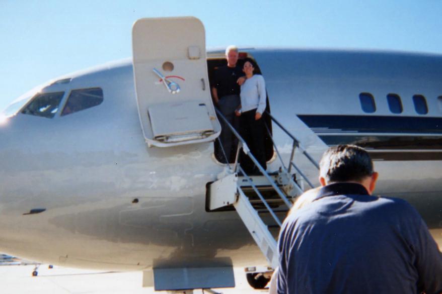 Bill Clinton poses with Ghislaine Maxwell as they board Jeffrey Epstein s notorious private jet.