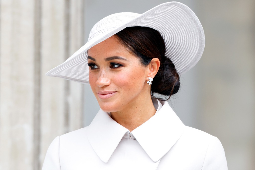 Meghan Markle in a white hat. 