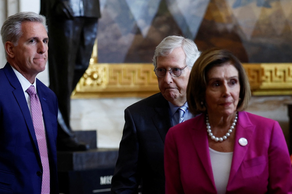 Senate Minority Leader Mitch McConnell and House Speaker Nancy Pelosi attend the unveiling of the Harry Truman statue at the Capitol rotunda.