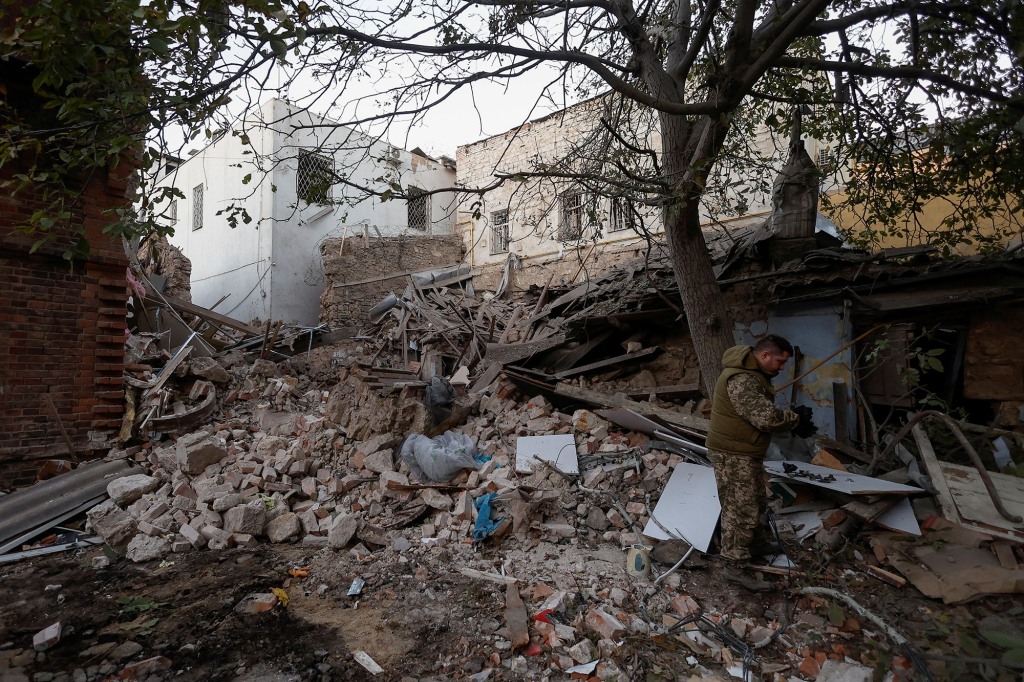 A Ukrainian serviceman at a residential building damaged by Russian shelling in Mykolaiv, Ukraine on October 18, 2022.