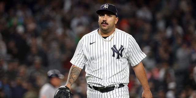 Nestor Cortes #65 of the New York Yankees walks back to the dugout during Game 4 of the ALCS between the Houston Astros and the New York Yankees at Yankee Stadium on Sunday, October 23, 2022, in New York, New York.