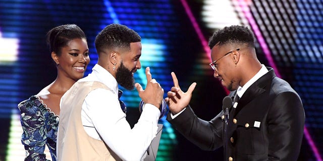 (L-R) Gabrielle Union and Odell Beckham Jr. present the Best Breakthrough Athlete award to Saquon Barkley onstage during the 2019 ESPYs at Microsoft Theater July 10, 2019, in Los Angeles.