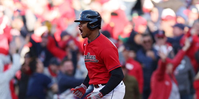 Oscar Gonzalez of the Cleveland Guardians celebrates after hitting a walk-off home run to end the game in the 15th inning against the Tampa Bay Rays in the second game of the wild-card series at Progressive Field on Oct. 8, 2022, in Cleveland.