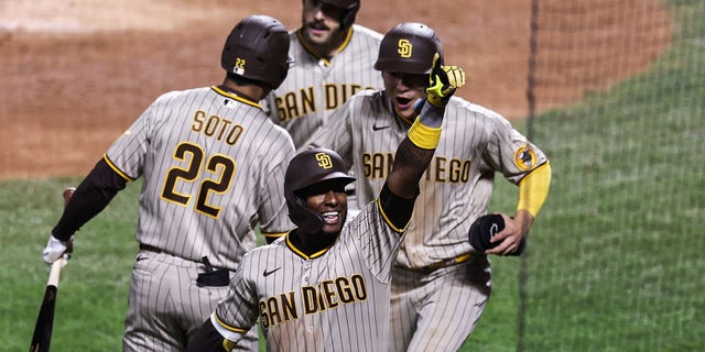 Jurickson Profar #10 of the San Diego Padres points to the crowd after hitting a three-run home run during the fifth inning of Game One of the NL Wild Card Series against the New York Mets at Citi Field on October 07, 2022 in the Flushing neighborhood of the Queens borough of New York City.