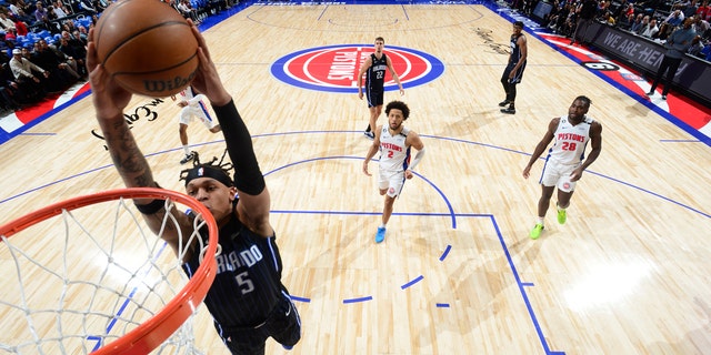 Paolo Banchero (5) of the Orlando Magic drives to the basket during a game against the Detroit Pistons Oct. 19, 2022, at Little Caesars Arena in Detroit. 