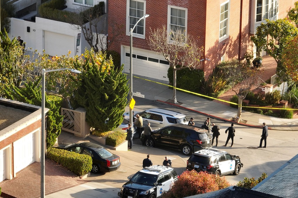 San Francisco police officers and FBI agents at Pelosi's home after the brutal attack.