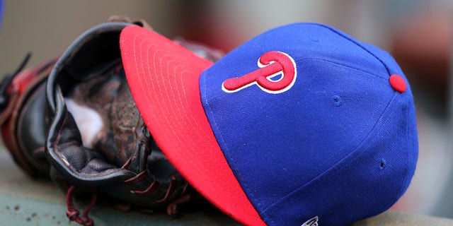 A Philadelphia Phillies cap sits on a dugout step during a game against the New York Mets at Citizens Bank Park Aug. 18, 2018, in Philadelphia.