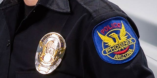 This file images shows a badge on a Phoenix police officer. 