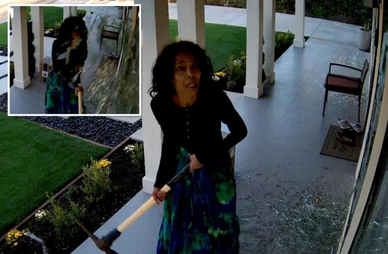 Video shows California woman with pickaxe smashing windows