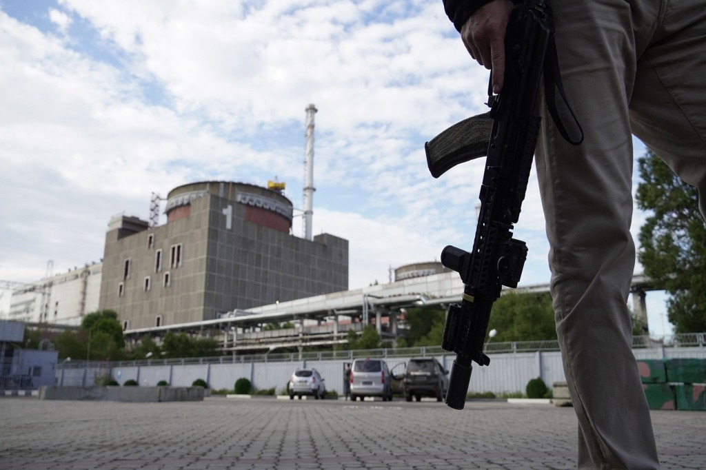 This photo taken on Sept. 11, 2022 shows a security person standing in front of the Zaporizhzhia Nuclear Power Plant in Enerhodar (Energodar), Zaporizhzhia Oblast, amid the ongoing Russian military action in Ukraine.