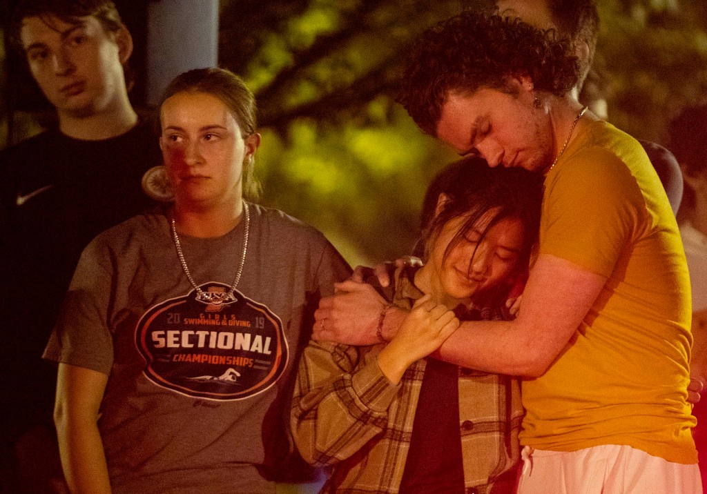 Mourners after slaying on Purdue student