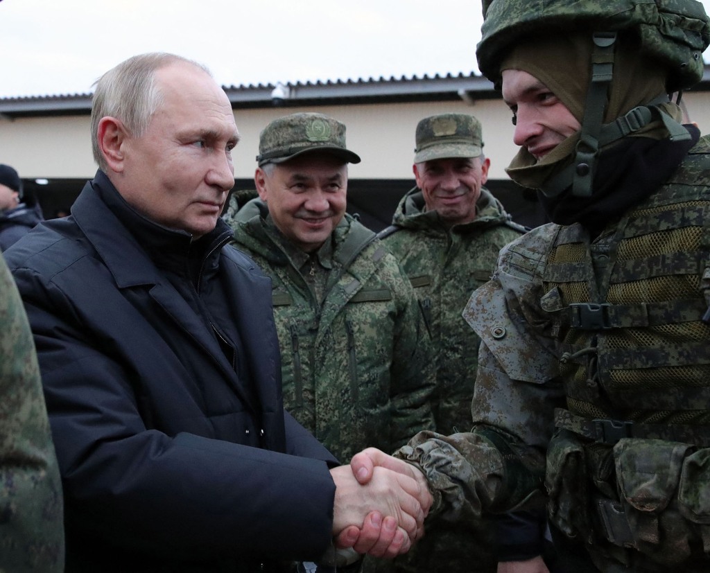 Former Ukraine correspondent Tom Warner noted that Putin, left, appeared "puffy," speculating that it could be due to steroid use.  