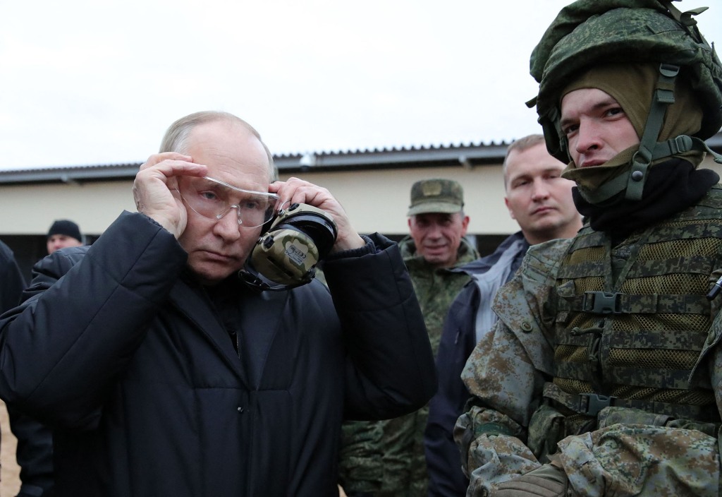 Officials images that were put out by Russia's Ministry of Defense do not offer a clear view of Putin's hands. 