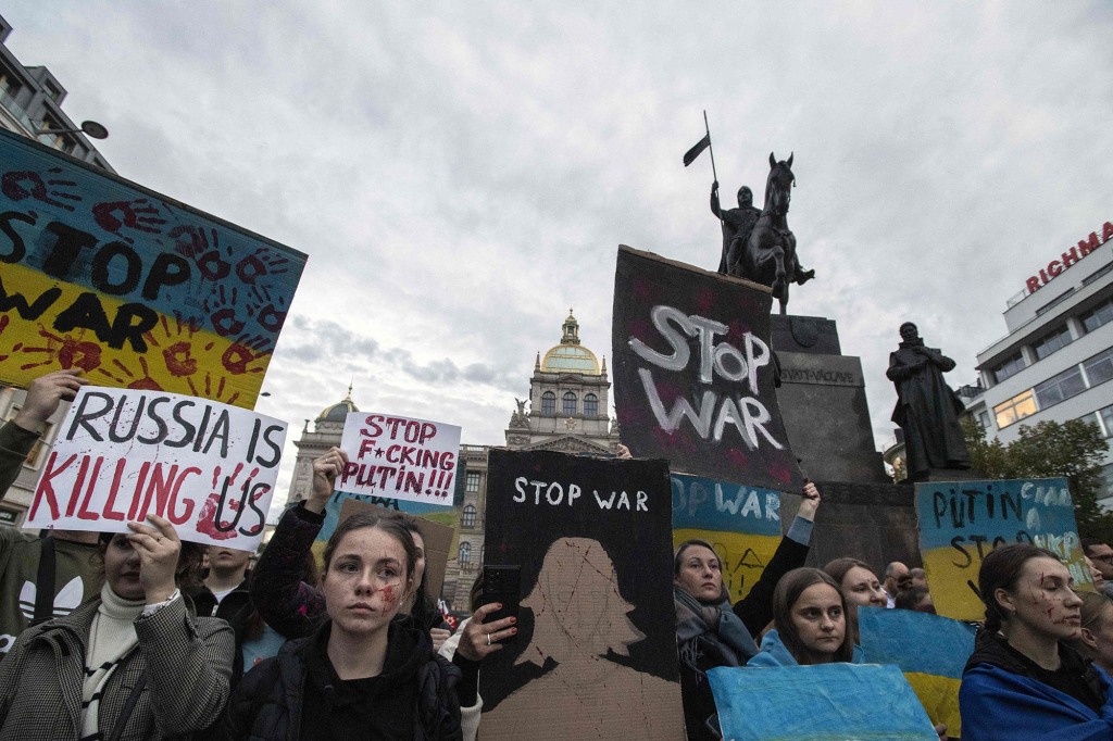 Protesters rally against Russia's war.
