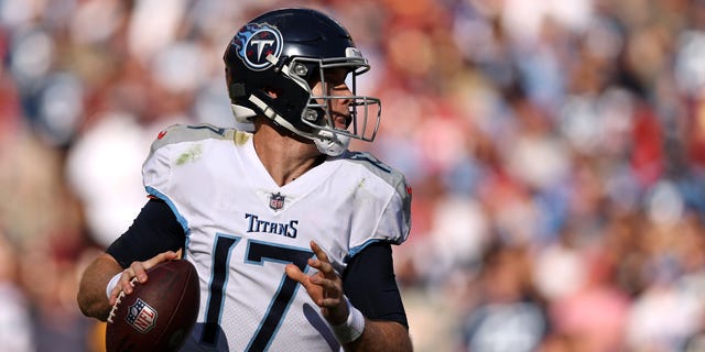 Ryan Tannehill #17 of the Tennessee Titans scrambles with the ball during the second half against the Washington Commanders at FedExField on October 09, 2022 in Landover, Maryland.