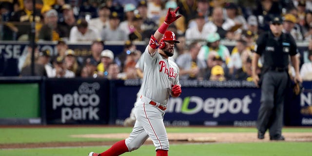 Kyle Schwarber #12 of the Philadelphia Phillies reacts after hitting a home run during the sixth inning against the San Diego Padres in game one of the National League Championship Series at PETCO Park on October 18, 2022 in San Diego, California.