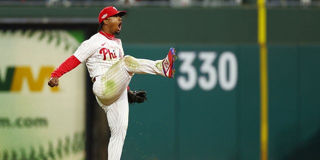 Jean Segura #2 of the Philadelphia Phillies celebrates after making a diving stop and throwing out Ha-Seong Kim #7 of the San Diego Padres (not pictured) at first base during the seventh inning in game three of the National League Championship Series at Citizens Bank Park on October 21, 2022 in Philadelphia, Pennsylvania.